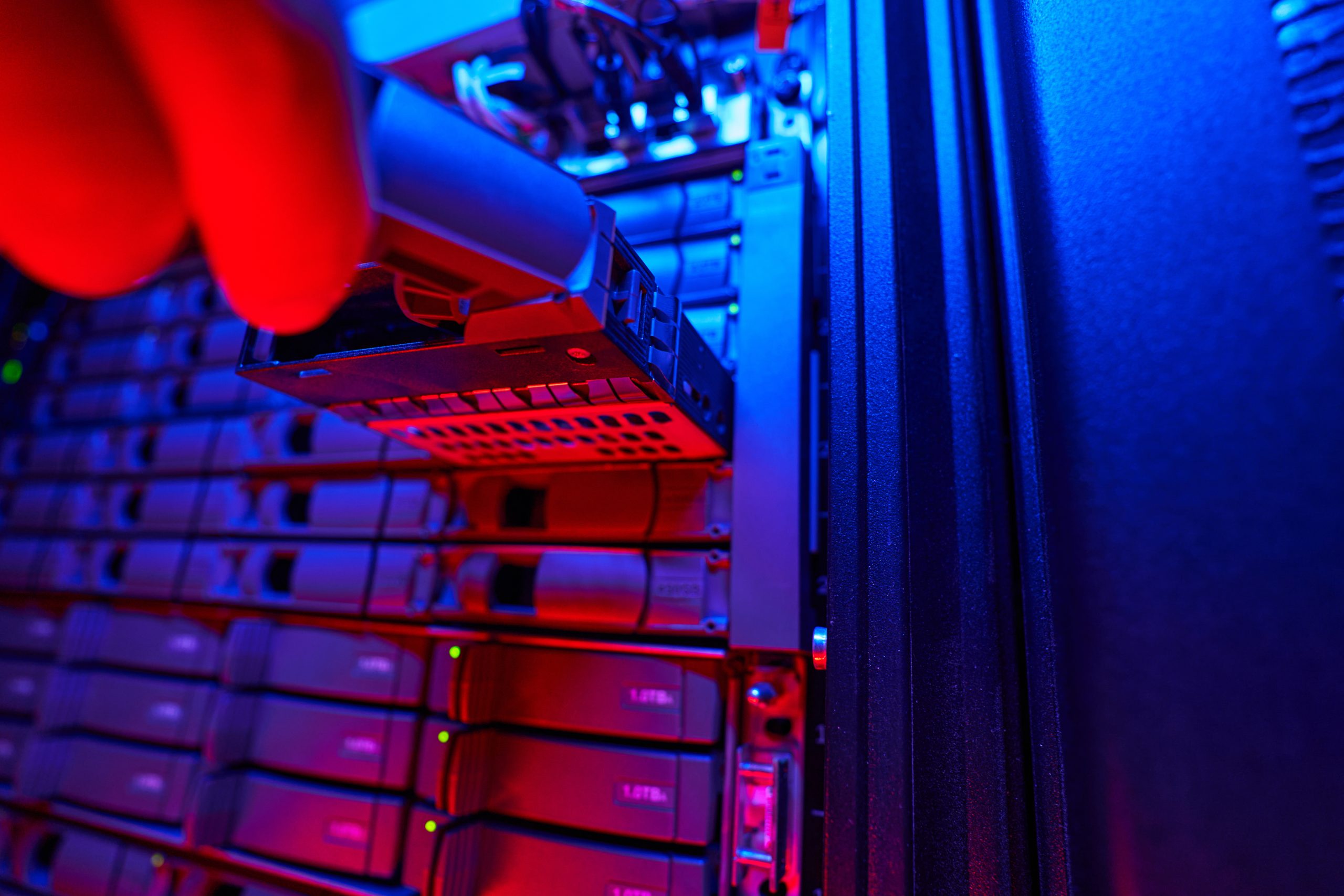 Close up low angle portrait of unrecognized it engineer examining hard drives